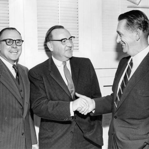 [Edmund G. (Pat) Brown (center), Democratic candidate for governor of California, meets with William Orrick Jr. (left) and District Attorney Thomas C. Lynch]