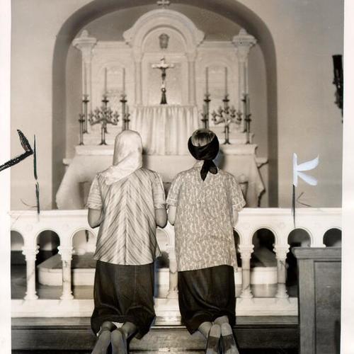 [Two expectant mothers praying at St. Elizabeth's Infant Shelter]