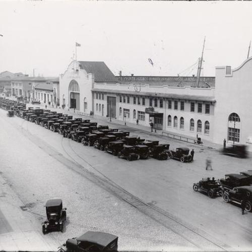 [Cars lined up on the Embarcadero, near the Ferry Building]