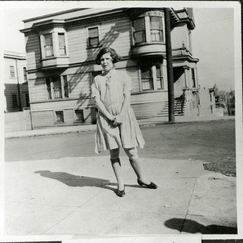 [Lorraine standing on the corner of Broderick and Eddy Streets in 1924]