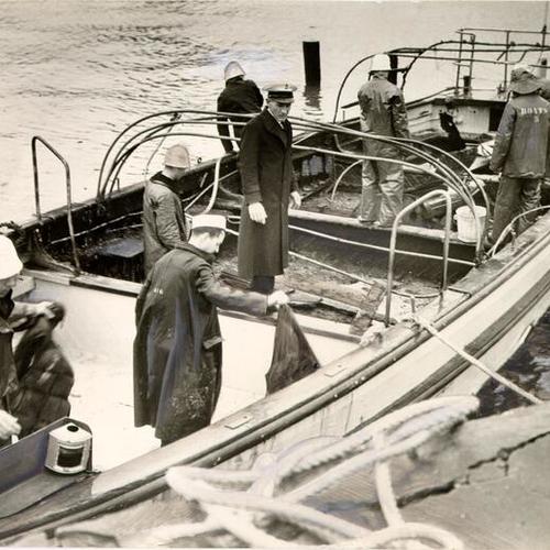 [Navy sailors on a small boat at Yerba Buena Island]