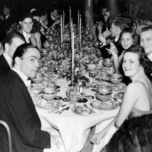 [Dinner party at the Mark Hopkins Hotel]