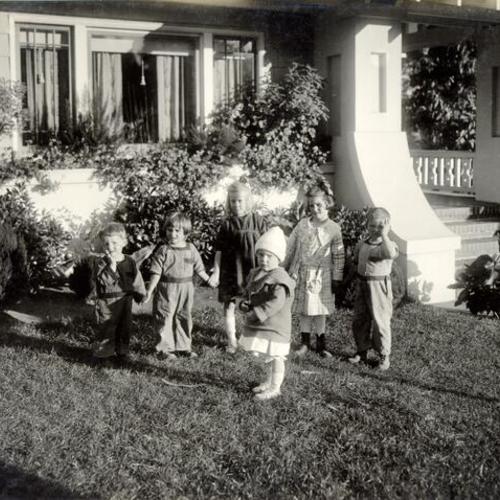 [Children standing on the lawn of 676  Miramar Avenue, home of the Gilberts]