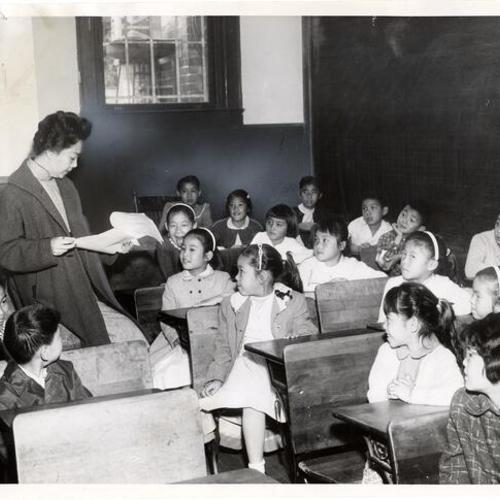 [Students seated in a classroom at Chinese Christian Academy]