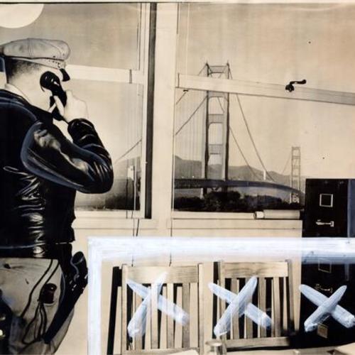 [Sergeant Thomas Wentworth shown at telephone in traffic control room and Golden Gate Bridge in the background]