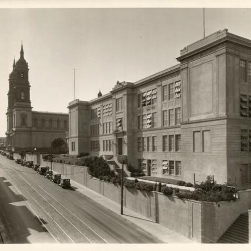[View of main St. Ignatius College building along Fulton Street with St. Ignatius church at Parker Avenue]