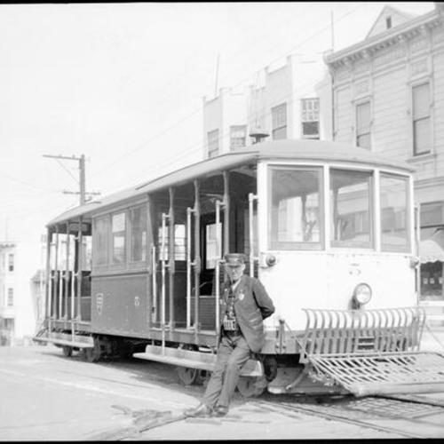 [Crew turning Castro street cable car on 26th and Castro streets turntable]