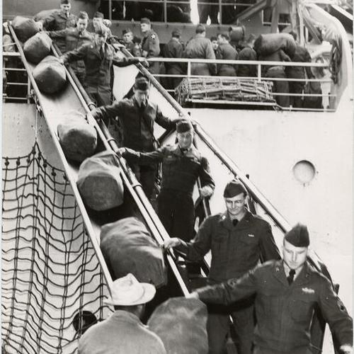 [Soldiers disembarking from a ship at Fort Mason]