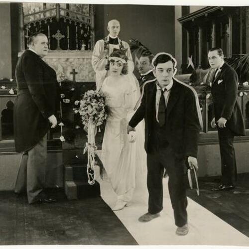 Buster Keaton and Margaret Leahy (center) in scene from "The Three Ages" with Joe Roberts (left)