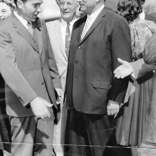 [Vice president Richard Nixon being greeted by George Christopher and Clifford E. Rishell on his arrival at San Francisco International Airport]