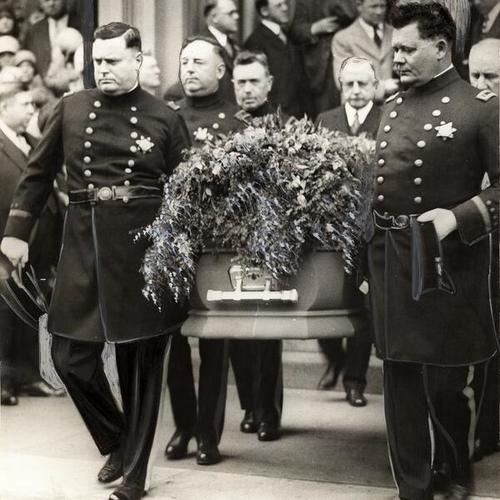[Officers carrying the coffin of Captain Eugene Wall]