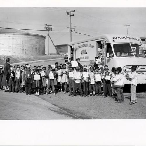 [Group of children with Library Bookmobile]