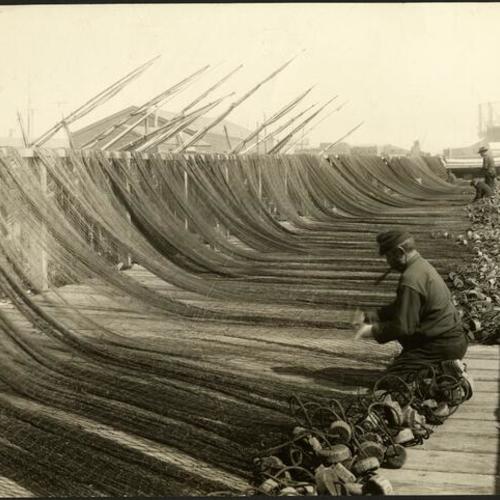 [Fishermen with nets at Fisherman's Wharf]