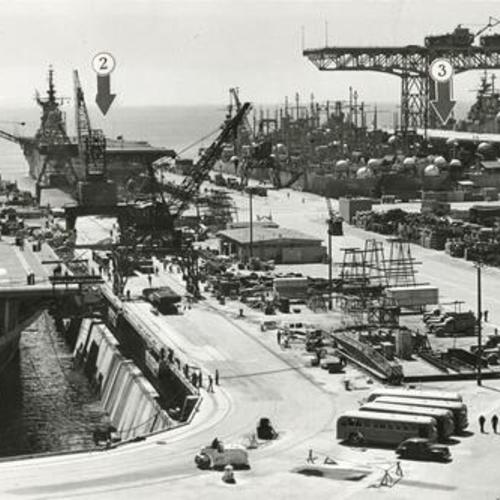 [Four aircraft carriers at Hunters Point Naval Shipyard]