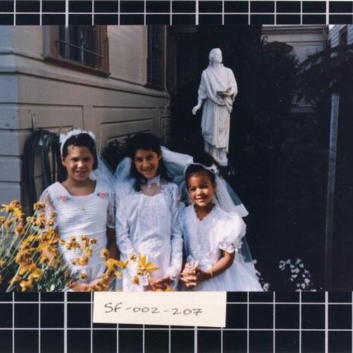 [Portrait of three girls on their first communion]