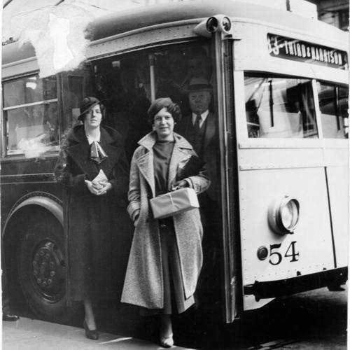 [Mary Fleming and Eleanor Chelli exiting Municipal Railway trackless trolley car number 54]