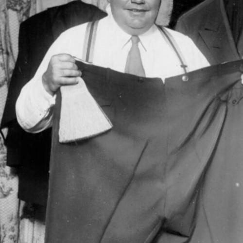 [Fatty Arbuckle holding pants]