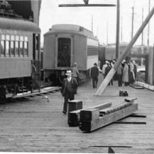 [Alcatraz Island prison train arriving at Oakland pier under heavy guard]