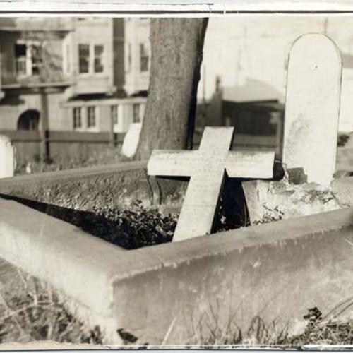 [Fallen gravestone at Laurel Hill Cemetery]