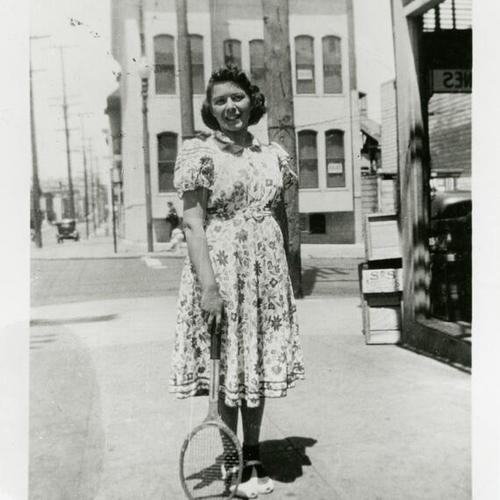 [Sally playing tennis on Scott Street in 1939]