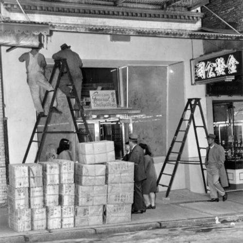 [Workers preparing a new grocery store on Grant Avenue in Chinatown]