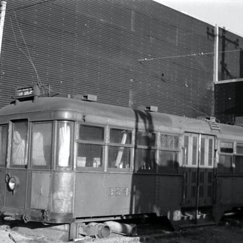 [Former Muni "J Type" car 354 used as contractor's shed at Dodge Plant in East Oakland]