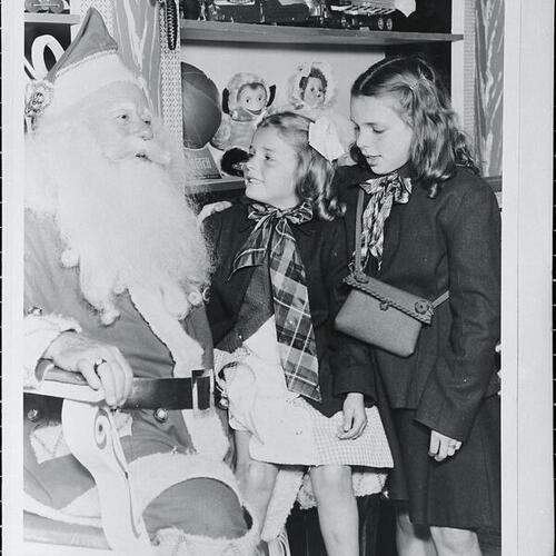 [Santa with Barbara and Judy most likely at the Emporium]
