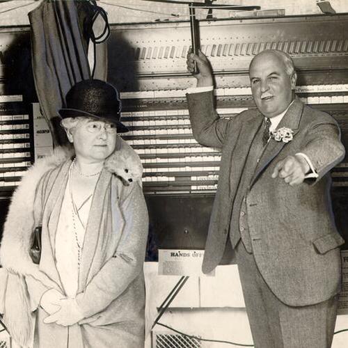 [James Rolph, Jr. and his wife casting a vote at a polling booth]