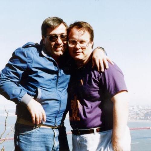 [Two men in Marin Headlands with view of Golden Gate Bridge in background]