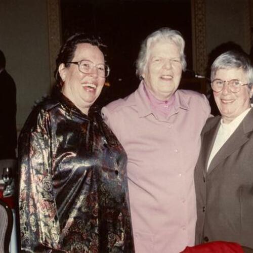 [Phyllis Lyon, Del Martin, and Louise Renne post for a picture at a dinner honoring Streicher]
