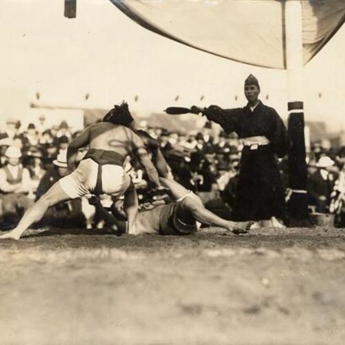 [Japanese wrestlers playing a game on Japan Day]