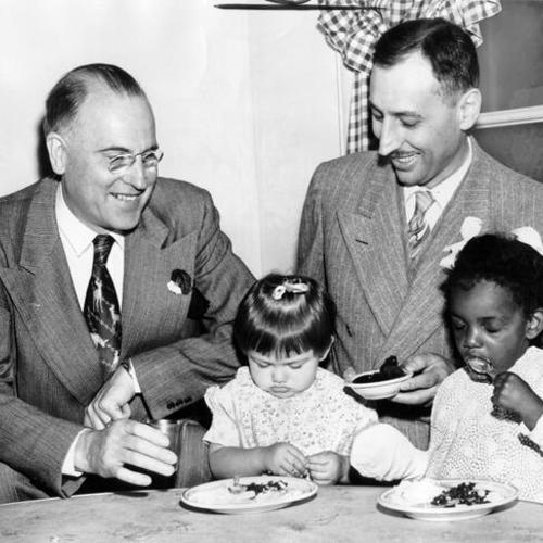 Drs. George H. Becker (left) and Berthel H. Henning among S.F. doctors visiting infant shelter on "Come and see" tour]