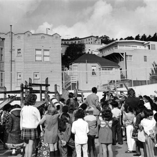 [Crowd of people at McKinley School playground]
