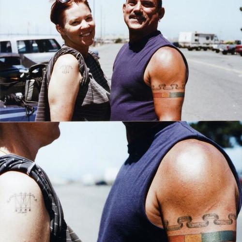 [Peter and Olivia with tattoos]