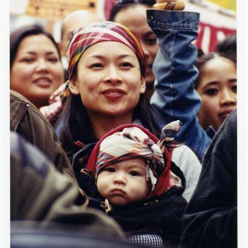 [Claudine and her son, Timyas, Joanne and Irene at an anti-war march on Market Street]