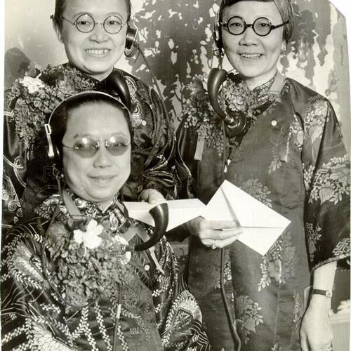 [Mrs. Grace Wong, Mrs. Nellie Jow and Mrs. Rose Mock, operators at the Chinatown Telephone Exchange]