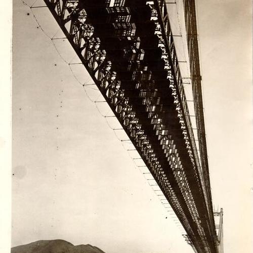 [Sea level view of Golden Gate Bridge deck during construction]