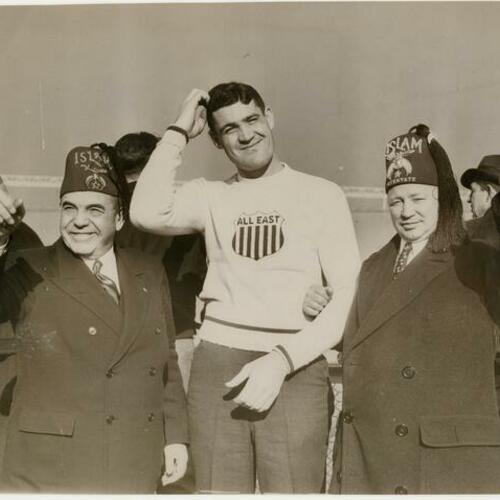William L. Hughson (left) in Shriner's hat with two others