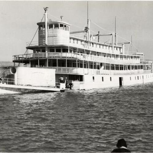 [Riverboat "Fort Sutter" partially submerged in water at Aquatic Park]