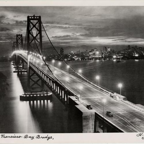 [Night view of San Francisco-Oakland Bay Bridge looking toward San Francisco]