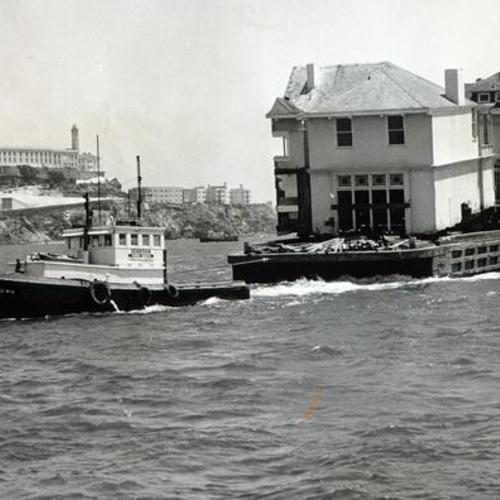 [Barge carrying the former mansion at 1888 Broadway to Belvedere]