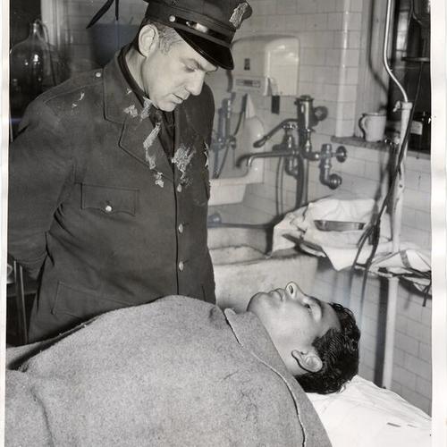 [Officer Frank Forencich with student H.R. Melendez]