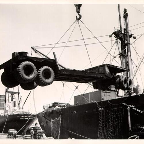 [Heavy trailer being loaded onto a ship at the San Francisco Port of Embarkation]
