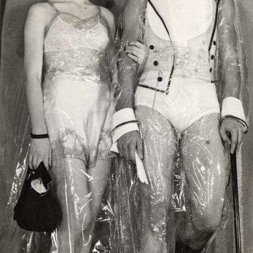 [Helen Reese and Don Crouse modeling a cellophane formal wear]