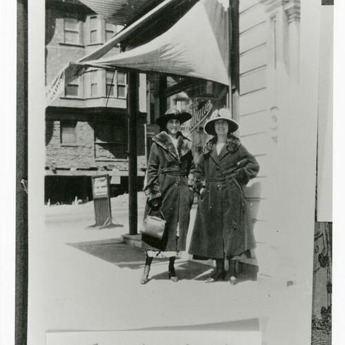 [Aunt Dora and unknown woman in front of store on Divisadero Street]