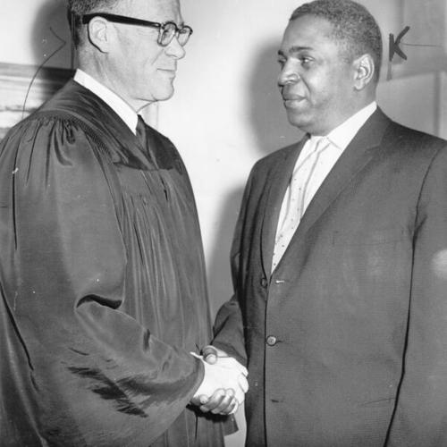 [Supervisor Terry Francois shaking hands with Judge James J. Welsh after being sworn into office]