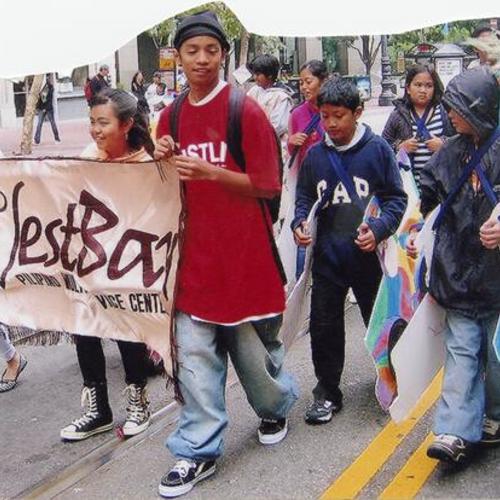 [Participants of West Bay's youth afterschool program marching in the Pistahan Festival Parade on Market Street]