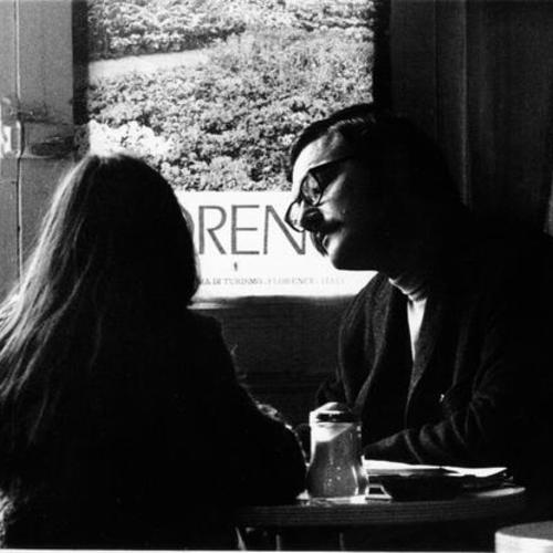 [Two people at Malvina Coffee Shop in North Beach]