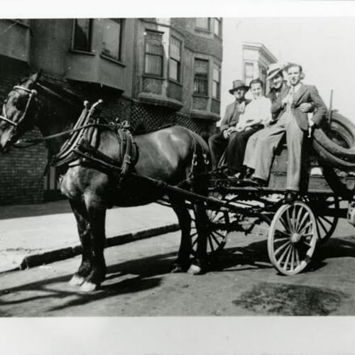 [Horse drawn recycling wagon with four men]