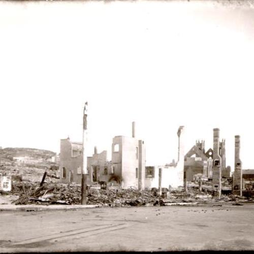[Chimneys towering above the wreckage left by the 1906 earthquake]